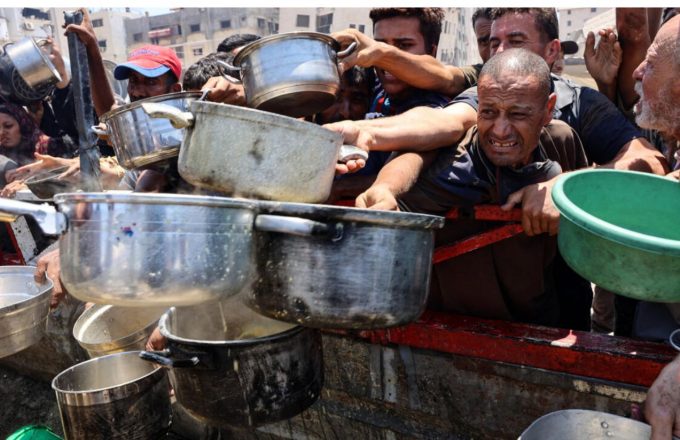 A crowd of people struggling to get some food in the Gaza Strip