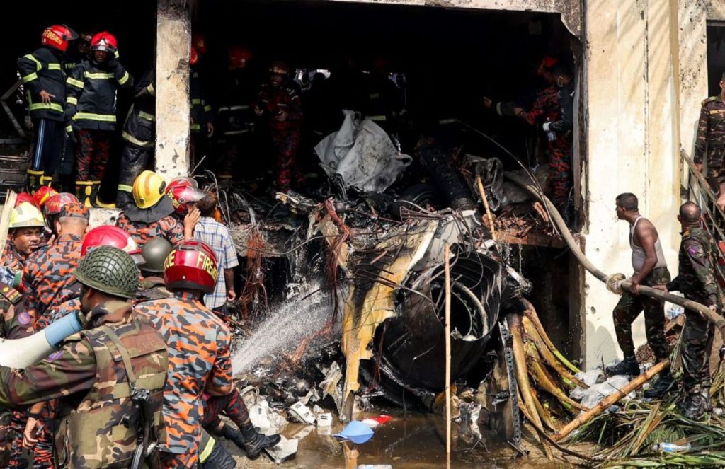 Many firefighters and first responders attending to the disaster caused by a plane crashing into a building