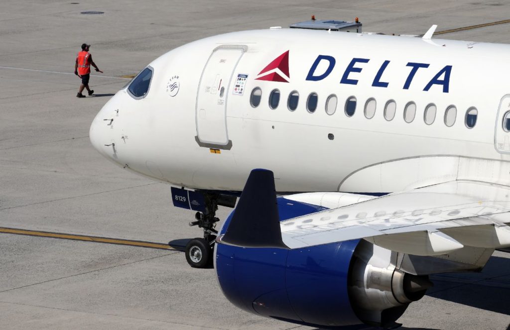 Authorities storm Delta flight and arrest copilot at JFK Airport A Delta jumbo jet featuring its signature white color and blue engines