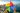 The iconic Google Photos logo with its distinctive red, yellow, blue, and green colors, set against a beautiful scenic background