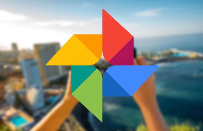 The iconic Google Photos logo with its distinctive red, yellow, blue, and green colors, set against a beautiful scenic background