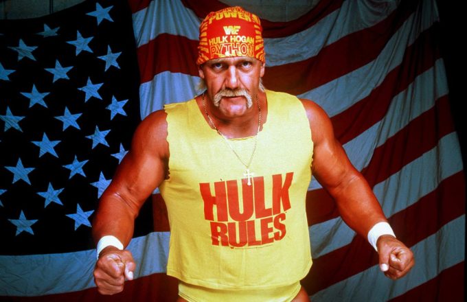 The great global icon showing off his massive muscles in front of the United States flag