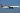A Delta Airlines plane flying over the beautiful blue sky in the United States