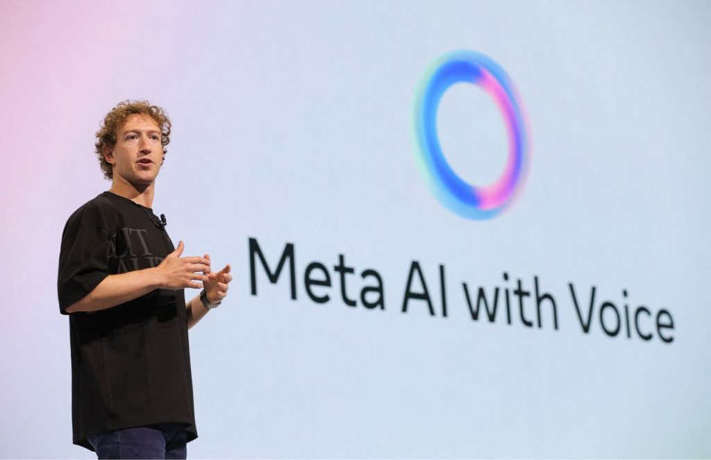 Mark Zuckerberg speaking at a META AI conference, wearing a black shirt with jeans and a slightly messy hairstyle