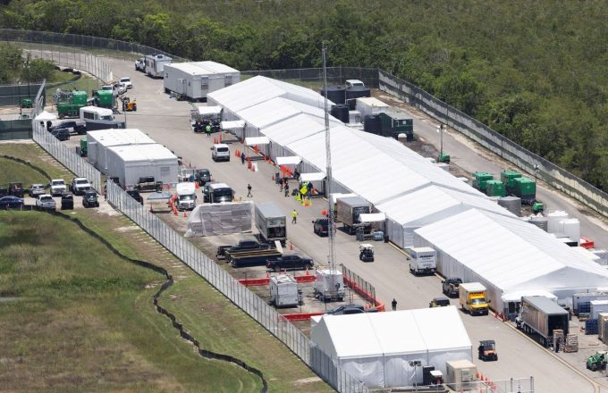 An aerial view of Alligator Alcatraz with several white tents