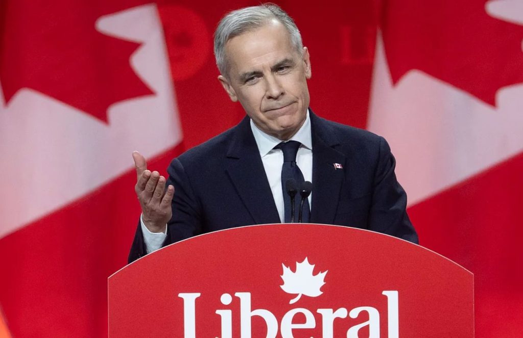 The Canadian Prime Minister standing at the podium speaking to the audience