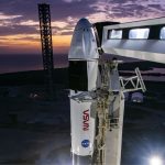 A white rocket belonging to SpaceX and NASA