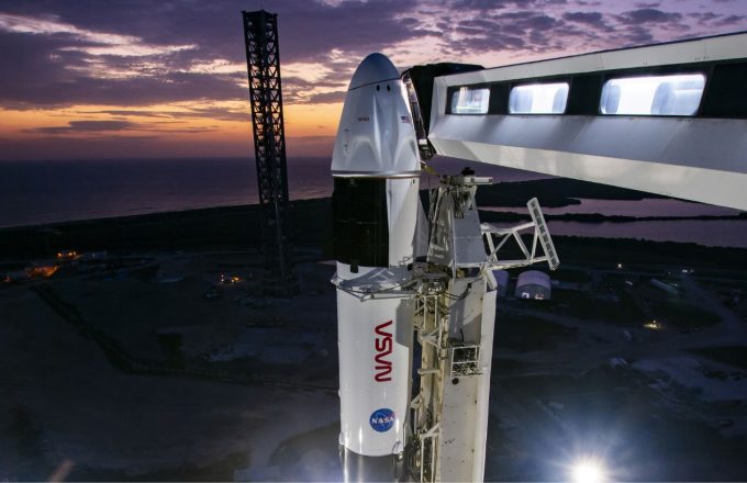 A white rocket belonging to SpaceX and NASA