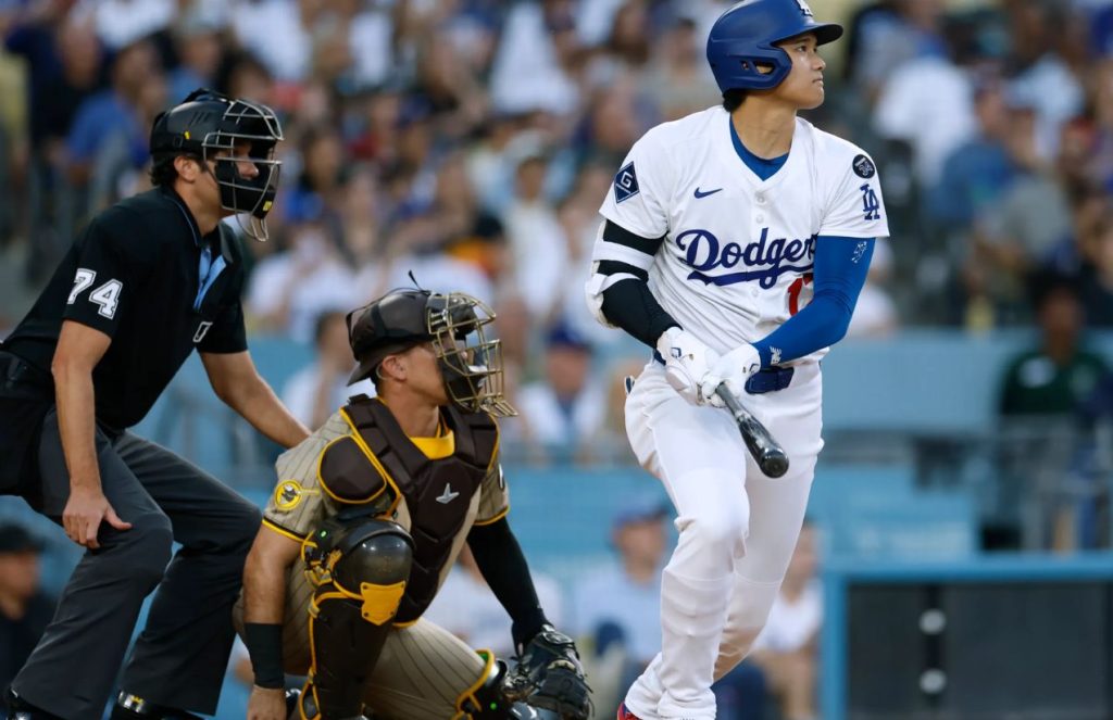 Shohei Ohtani in the batter’s box watching where the ball he just hit is headed