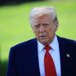 Donald Trump wearing an elegant blue suit