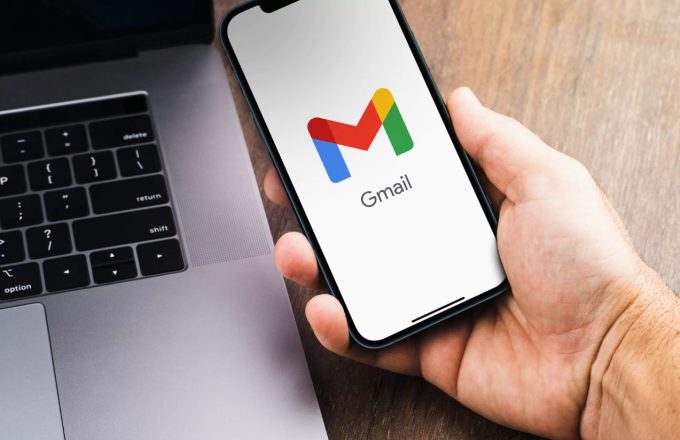 A person opening the Gmail app on their cellphone