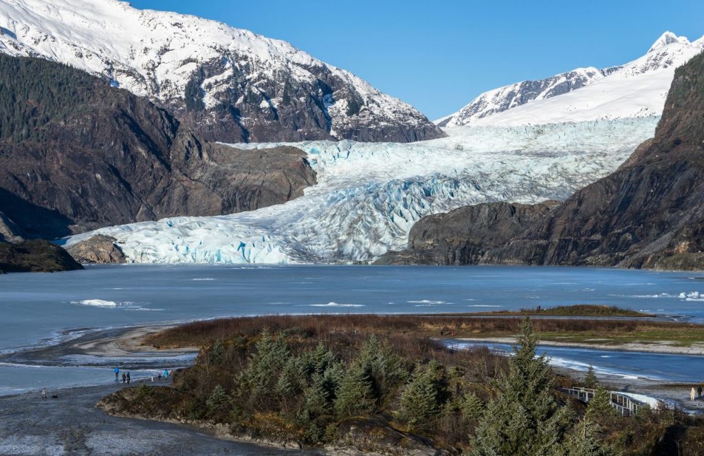 The majestic blue glacier nestled between two large mountains