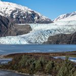 The majestic blue glacier nestled between two large mountains