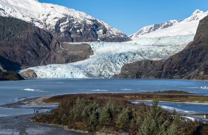The majestic blue glacier nestled between two large mountains