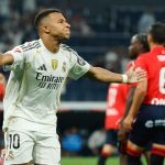 The fantastic French player celebrating with open arms while running after the penalty goal