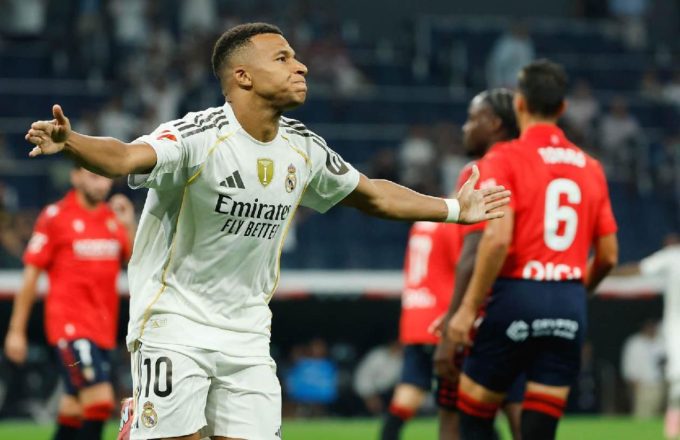 The fantastic French player celebrating with open arms while running after the penalty goal