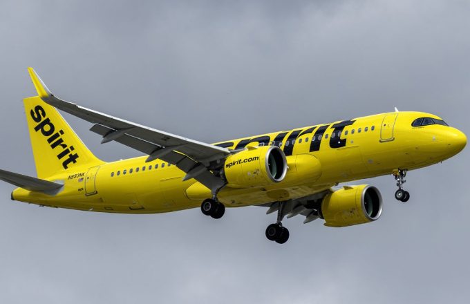 A yellow commercial airplane belonging to Spirit Airlines