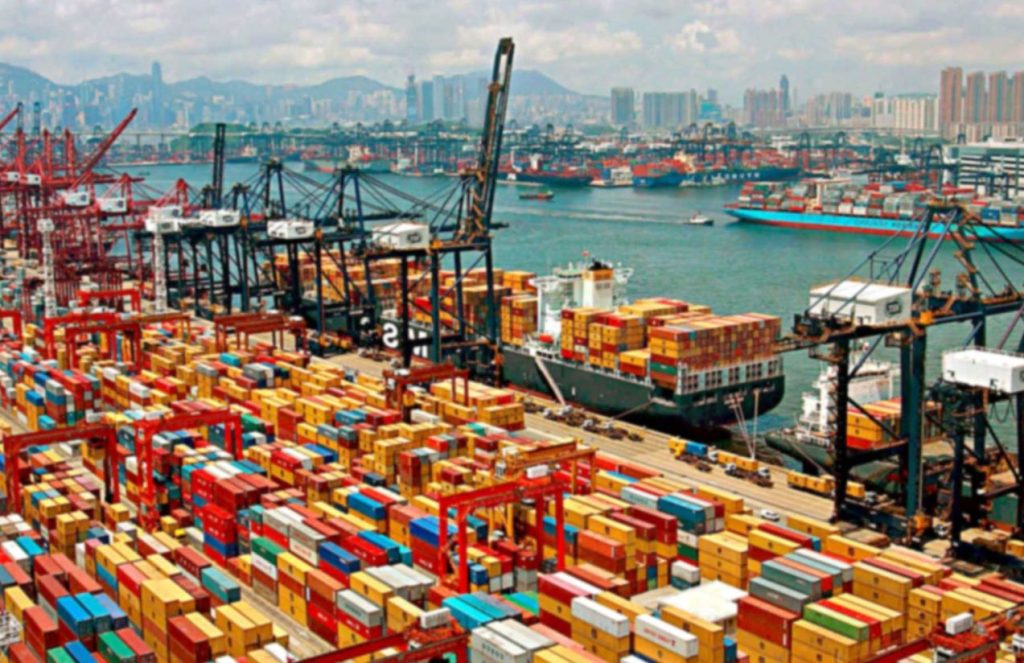 The massive port of China with numerous containers stacked one on top of another