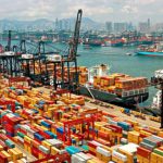 The massive port of China with numerous containers stacked one on top of another