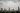 A panoramic view of a Vietnamese city covered in heavy clouds and rain