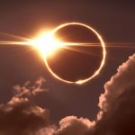 The sun being covered by the moon, creating a ring of light in the sky