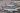 Several American Airlines planes parked at an airport waiting for all passengers to board