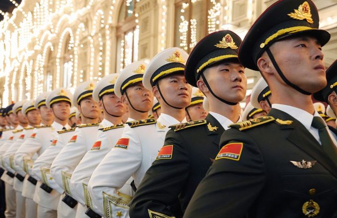 A row of Chinese military forces in their white uniforms