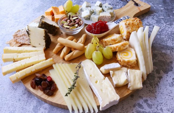 A table with different cheeses on top