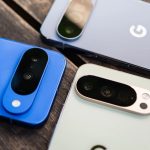Three Pixel 10 smartphones in blue, white, and gray, placed face down on a table