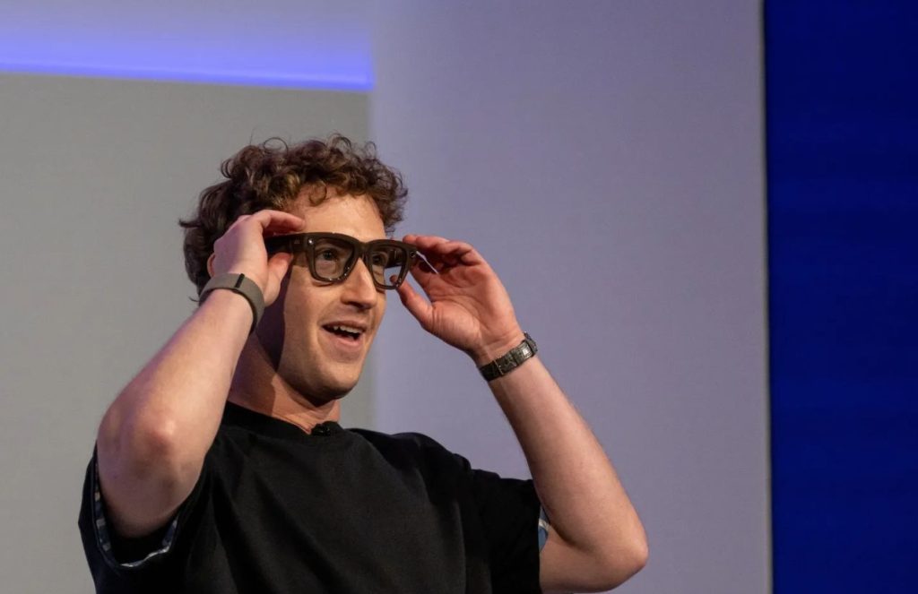 Mark Zuckerberg unveils the new Meta Ray-Ban display glasses: AI now in sight Mark putting on Meta’s new AI-powered glasses