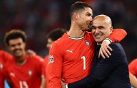 The Portuguese player and the Spanish coach sharing a hug after winning a final