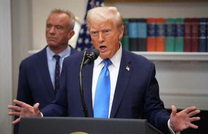 Trump speaking at a press conference with his arms wide open, as if to demonstrate the magnitude of the issue