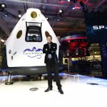 Elon Musk presenting a new SpaceX rocket in front of the entire audience