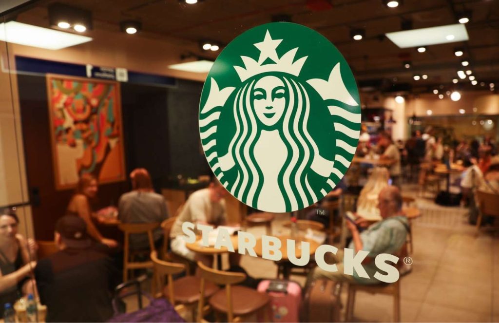 An elegant Starbucks store with the logo displayed on one of its windows