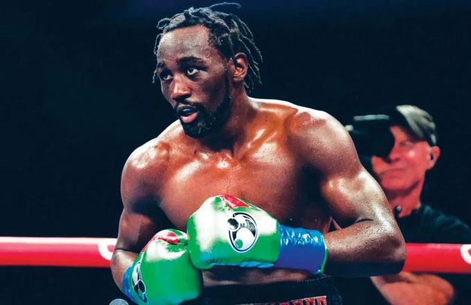 The famous boxer in a fighting stance in the middle of the ring