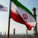 An Iranian flag with its respective green, white, and red colors