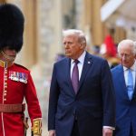 Trump walking on a red carpet accompanied by a classic United Kingdom soldier with a tall hat, while King Charles III follows closely behind
