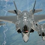 Three F-35 fighter jets flying across the skies