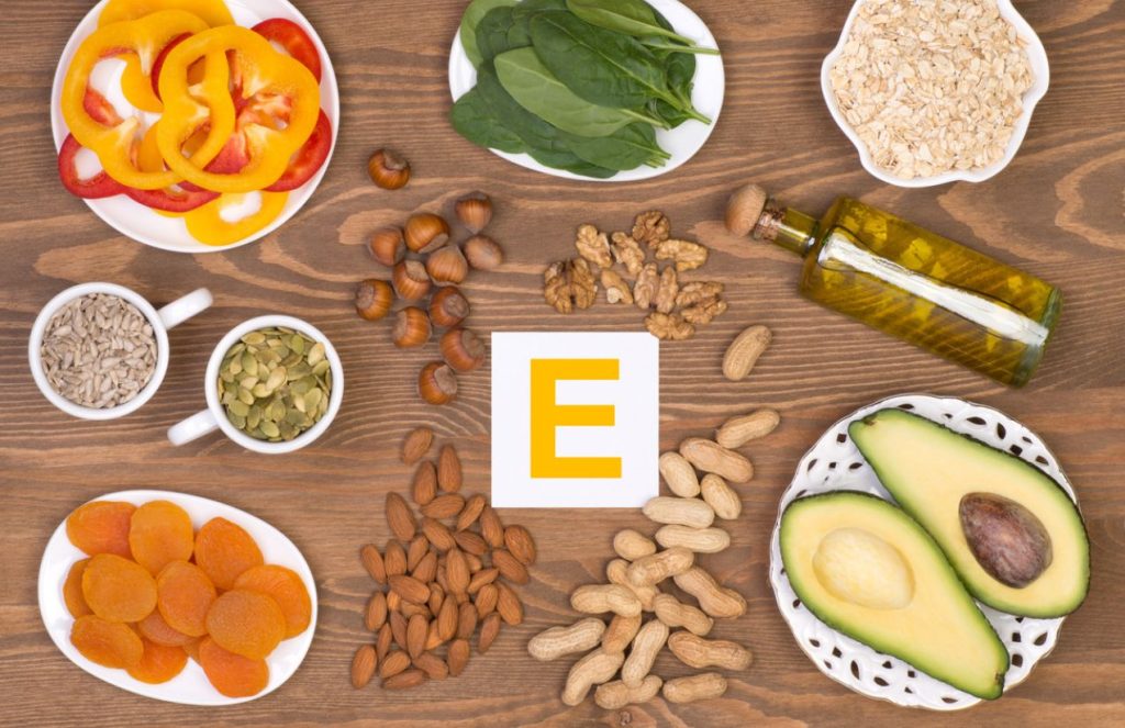 Different types of vegetables accompanied by various dishes of nuts on a table