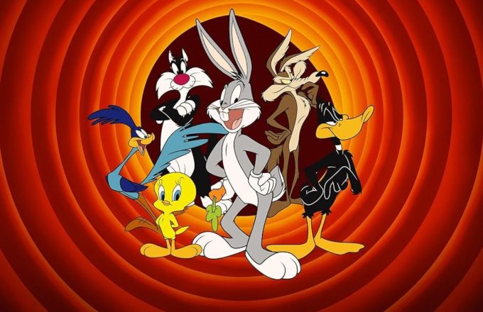 Some of Warner’s most iconic characters, such as Daffy Duck and Bugs Bunny, smiling