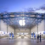 A stunning Apple store with the iconic apple logo displayed above it