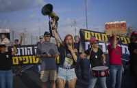 Several people campaigning to end the war between Israel and Hamas