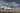 Munich airport with several planes parked, waiting for clearer skies