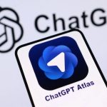 The Atlas app open on a smartphone with the word “ChatGPT” displayed in the background