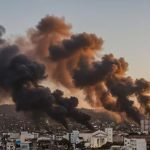 A panoramic view of Rio de Janeiro’s favelas, with smoke rising from some streets as a result of the police operation