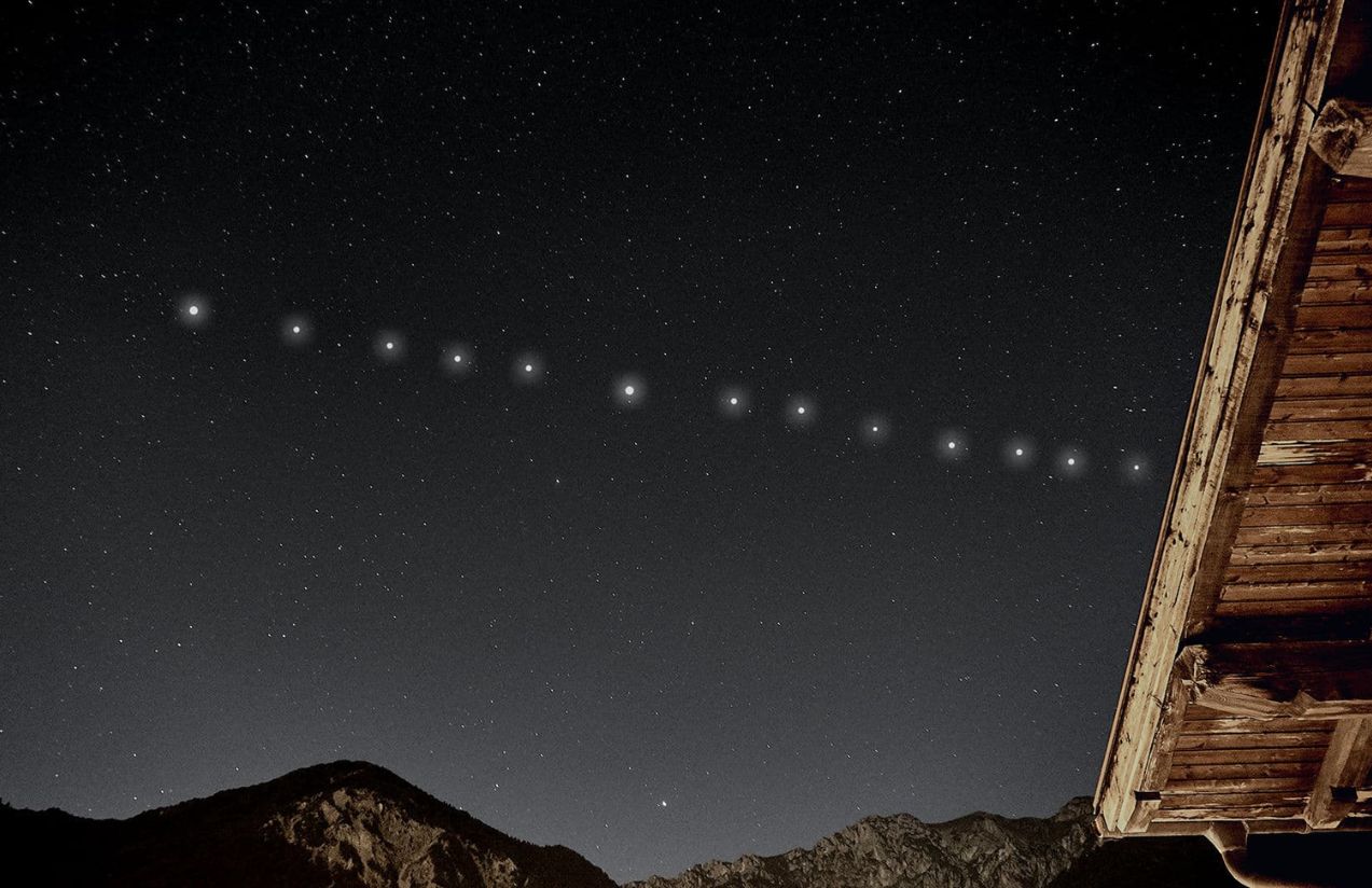 A view from Earth of the Starlink satellites, which appear as a line of stars
