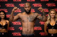 The famous boxer posing and flexing his muscles toward the camera