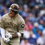 Machado celebrating his three-run homer with great euphoria