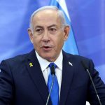 The Israeli prime minister speaking to the public from his office