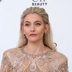 Paris Jackson posing for the cameras in a beautiful dress on a red carpet